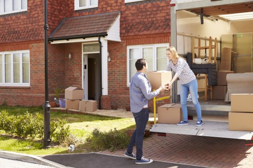 Removal team planning a house move on a Highgate street