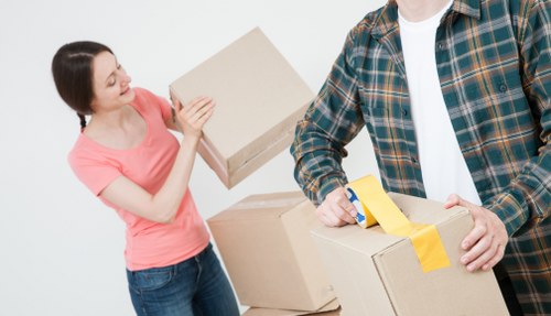 Careful loading of boxes and furniture into a removals van