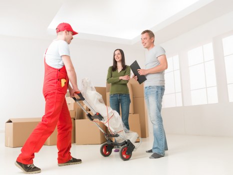 Packed boxes and furniture ready for a local move in Highgate