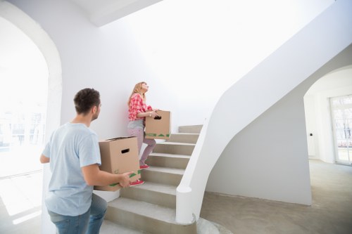 Furniture being moved carefully from a Highgate property with stairs