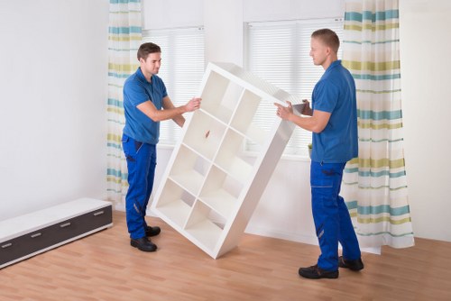 Professional movers handling office furniture and equipment in Highgate