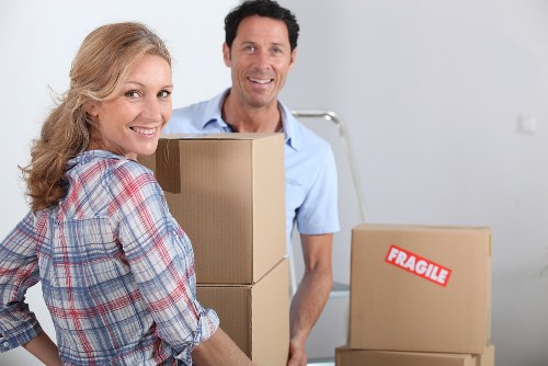 Professional movers handling boxes and furniture in Highgate