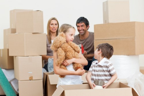 Packed moving boxes and furniture ready for transport in Highgate